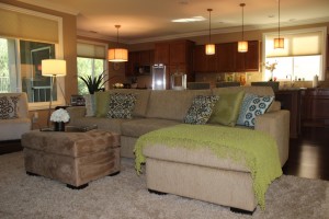 Modern living room featuring custom sectional and ottoman in Menifee, CA